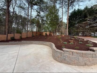 Concrete Drive & Retaining Wall project by Andrew's Landscaping in the Charlotte NC area