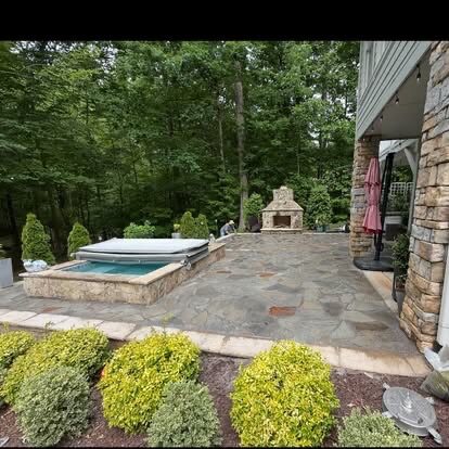 Hot Tub & Outdoor Fireplace project by Andrew's Landscaping in the Charlotte NC area