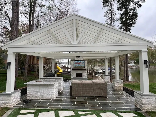 Custom outdoor kitchen and living space built by Andrew's Landscaping