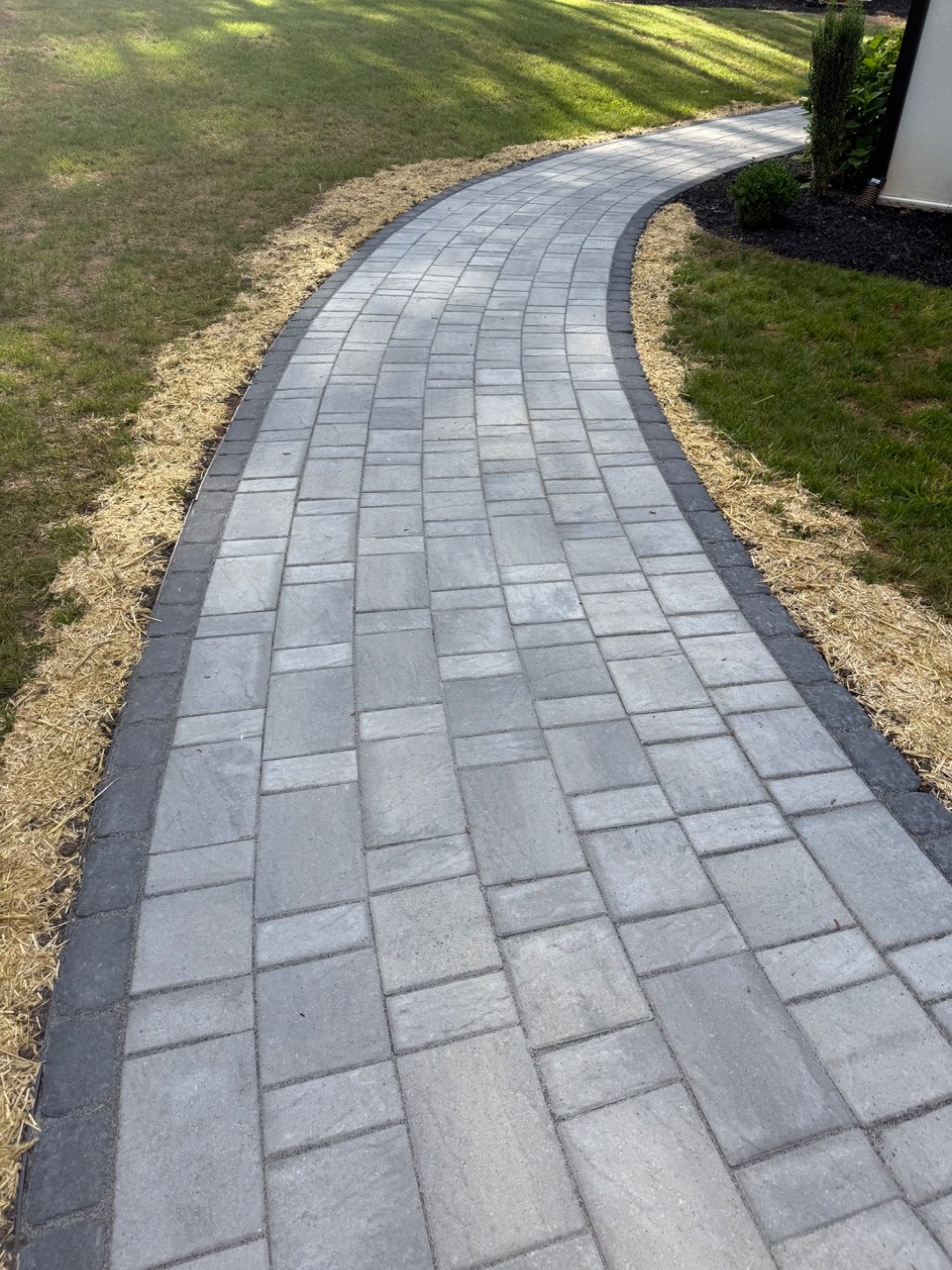 Outdoor living space at dusk built by Andrew's Landscaping